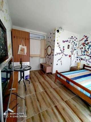 Апартаменты FLAMINGO APARTMENTS Бар Четырехместный номер с видом на море-9